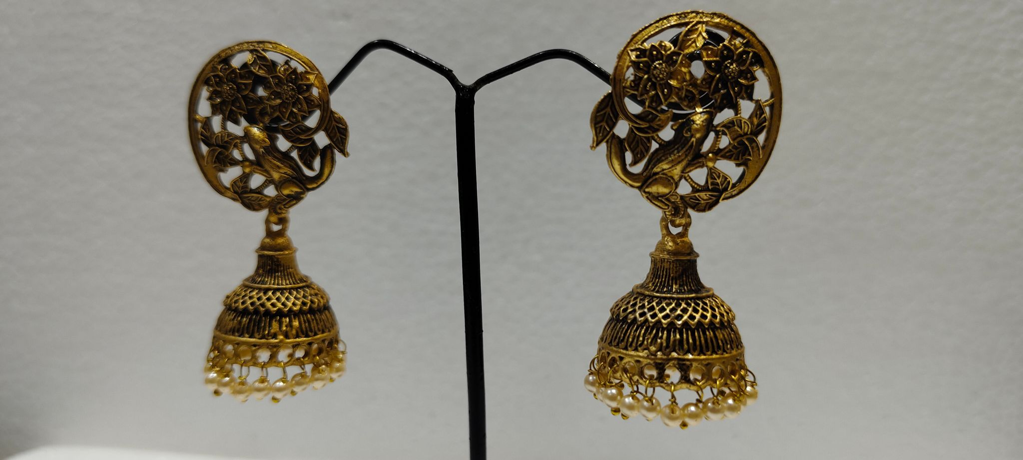 "Golden Peacock Jhumka Earrings with Pearl Drops"