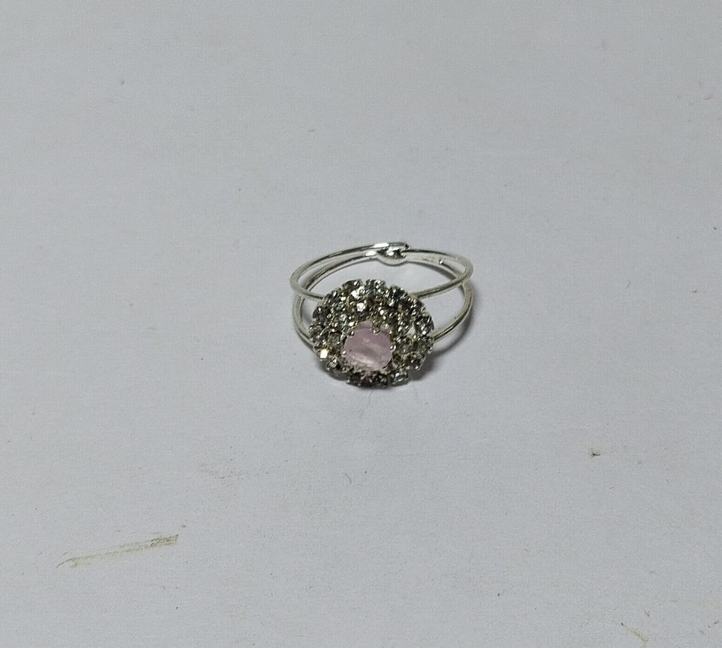 "Elegant Silver-Plated Ring with Pink Center Stone and Rhinestone Accents"