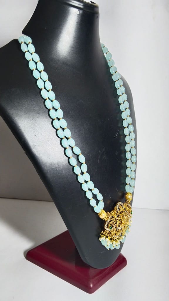"Stunning South Indian Temple Jewelry Necklace Set with Sky Blue Beads and Gold-Plated Pendant"