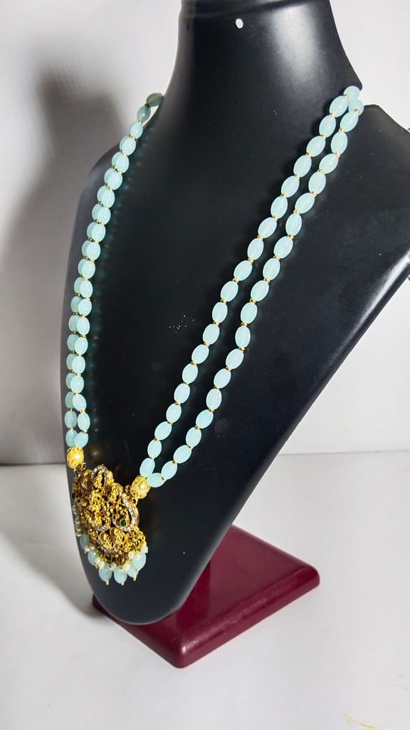 "Stunning South Indian Temple Jewelry Necklace Set with Sky Blue Beads and Gold-Plated Pendant"