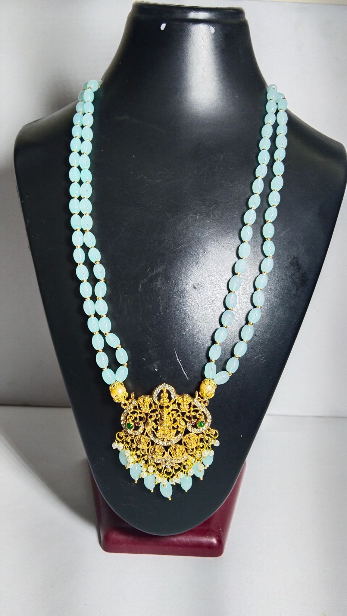 "Stunning South Indian Temple Jewelry Necklace Set with Sky Blue Beads and Gold-Plated Pendant"