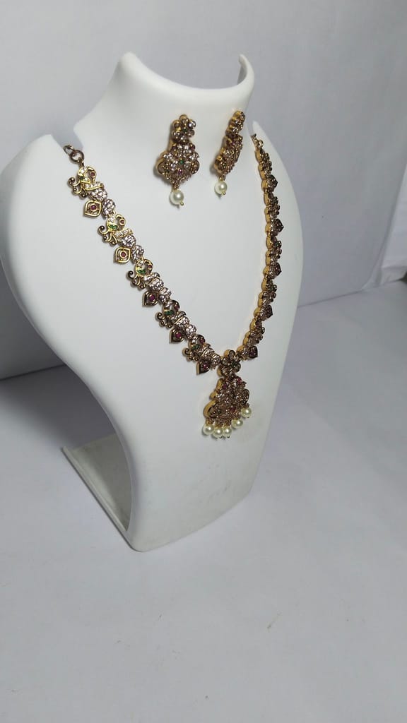 Stunning antique gold plated traditional necklace set with intricate detailing and pearl drops