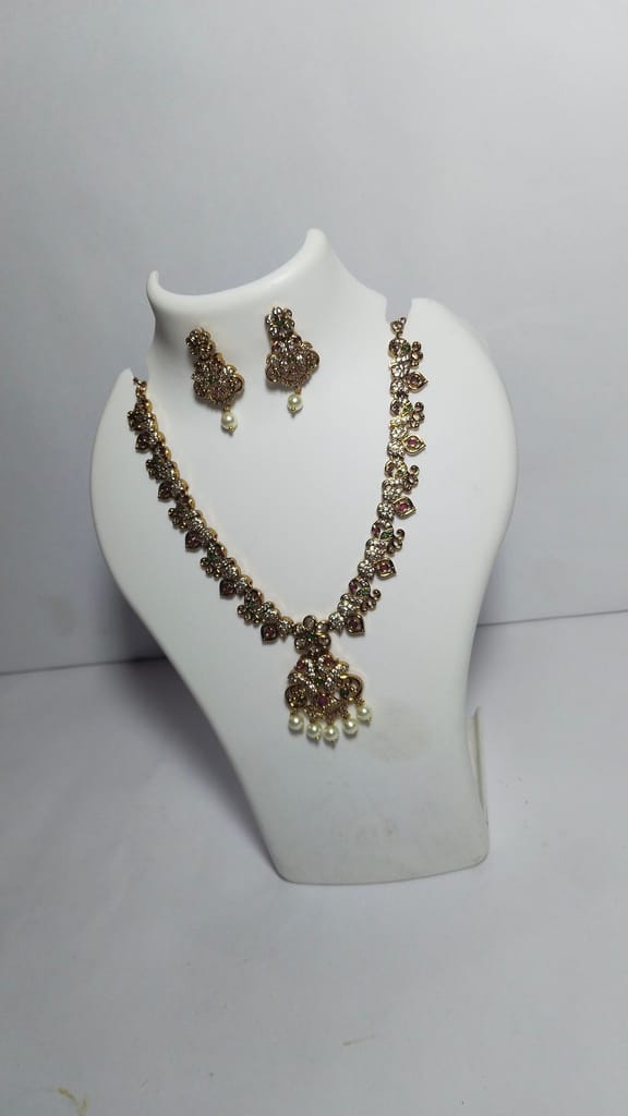 Stunning antique gold plated traditional necklace set with intricate detailing and pearl drops
