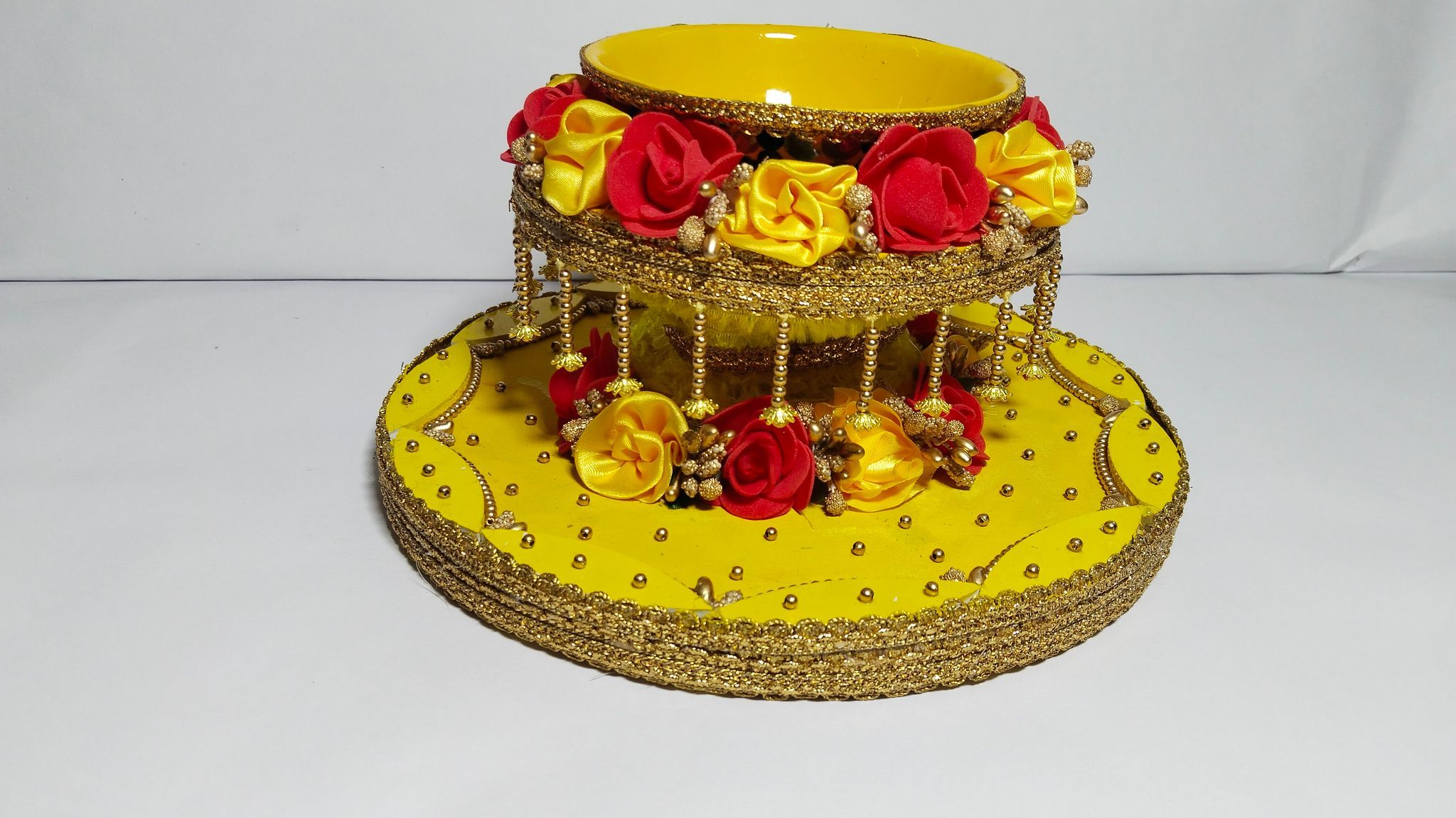 Yellow and red decorative bowl with flowers