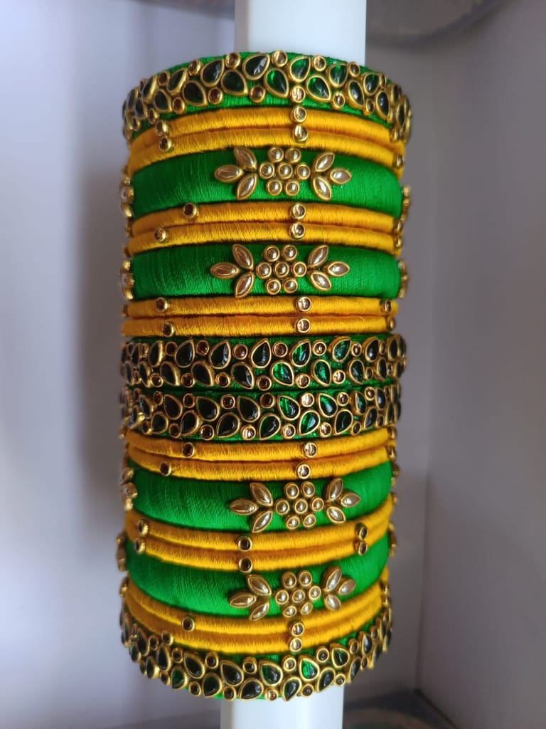 Green and gold silk thread bangles with kundan stones