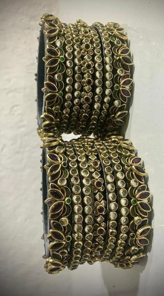 Exquisite Kundan and Pearl Bangle Set with Green Stones