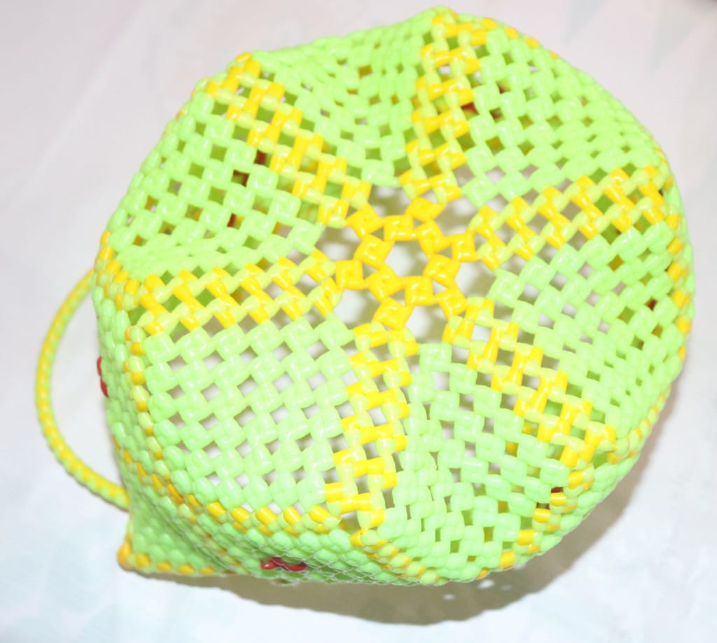 Green and Yellow Beaded Basket with Red Flower Accents