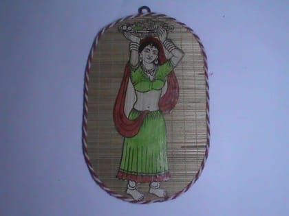 Hand painted wall hanging of a woman carrying a basket on her head