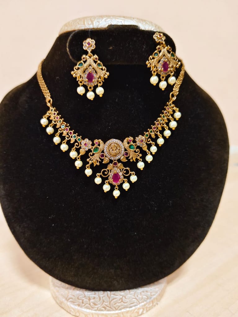 "Stunning Antique Gold Necklace Set with Peacock Earrings and Pearls"