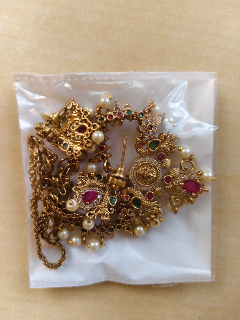 "Stunning Antique Gold Necklace Set with Peacock Earrings and Pearls"