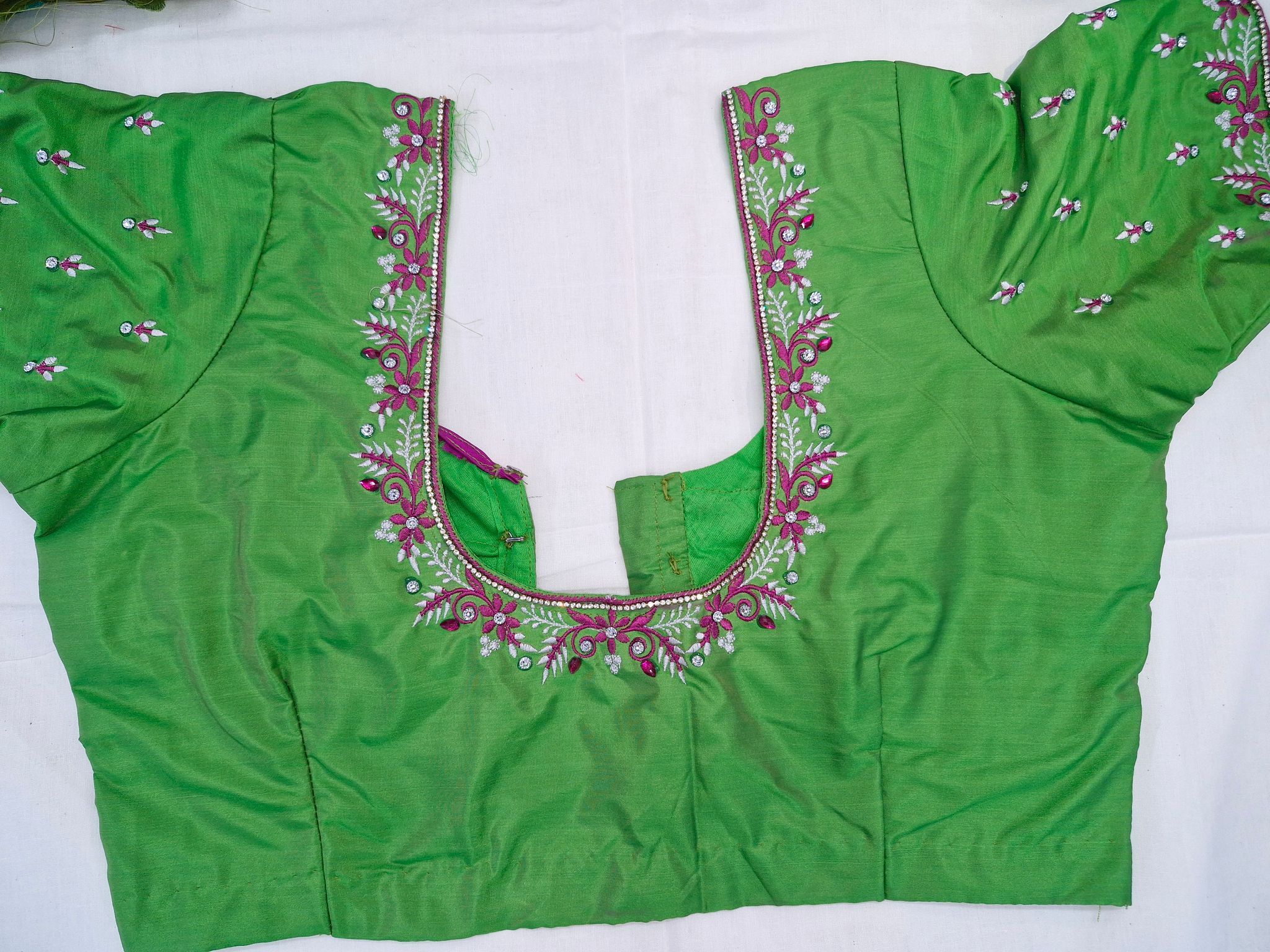 Green blouse with intricate embroidery