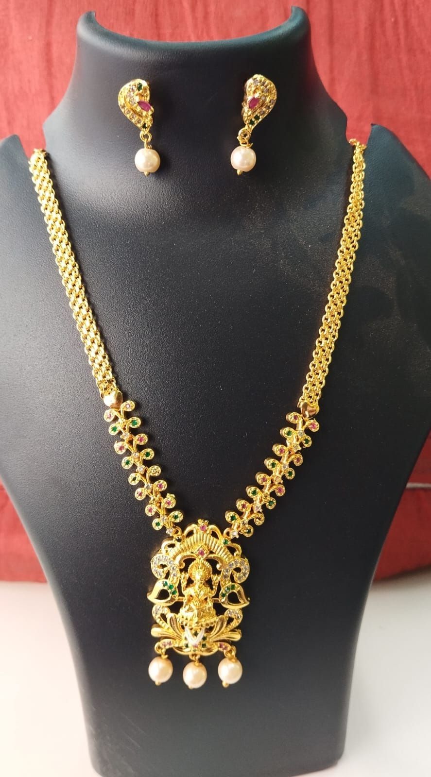 Traditional gold plated Lakshmi pendant necklace set with matching earrings