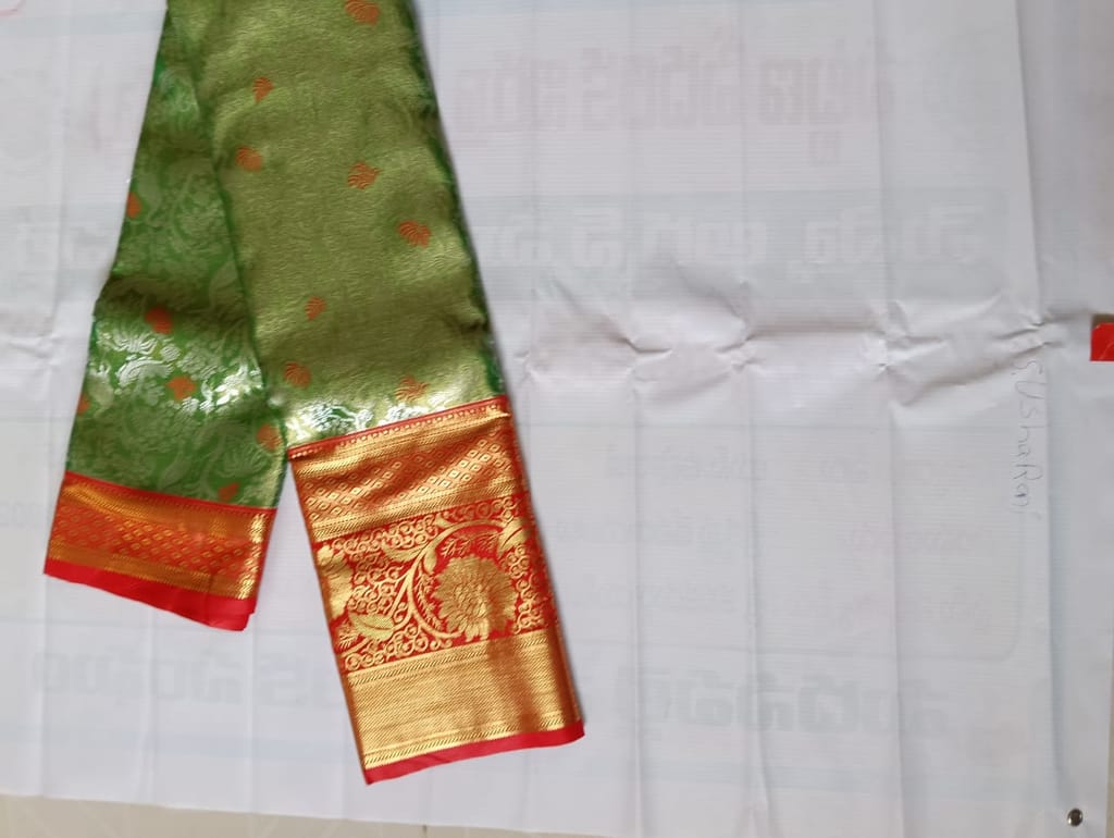 Red and gold zari work silk saree with blouse piece