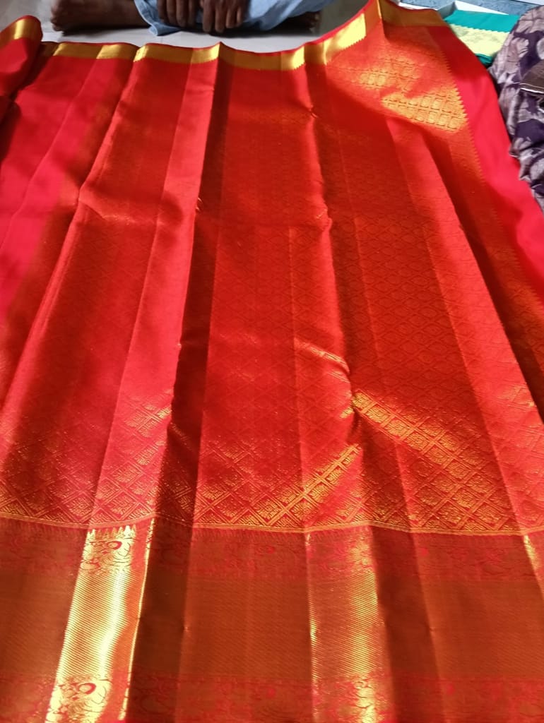 Red and gold zari work silk saree with blouse piece