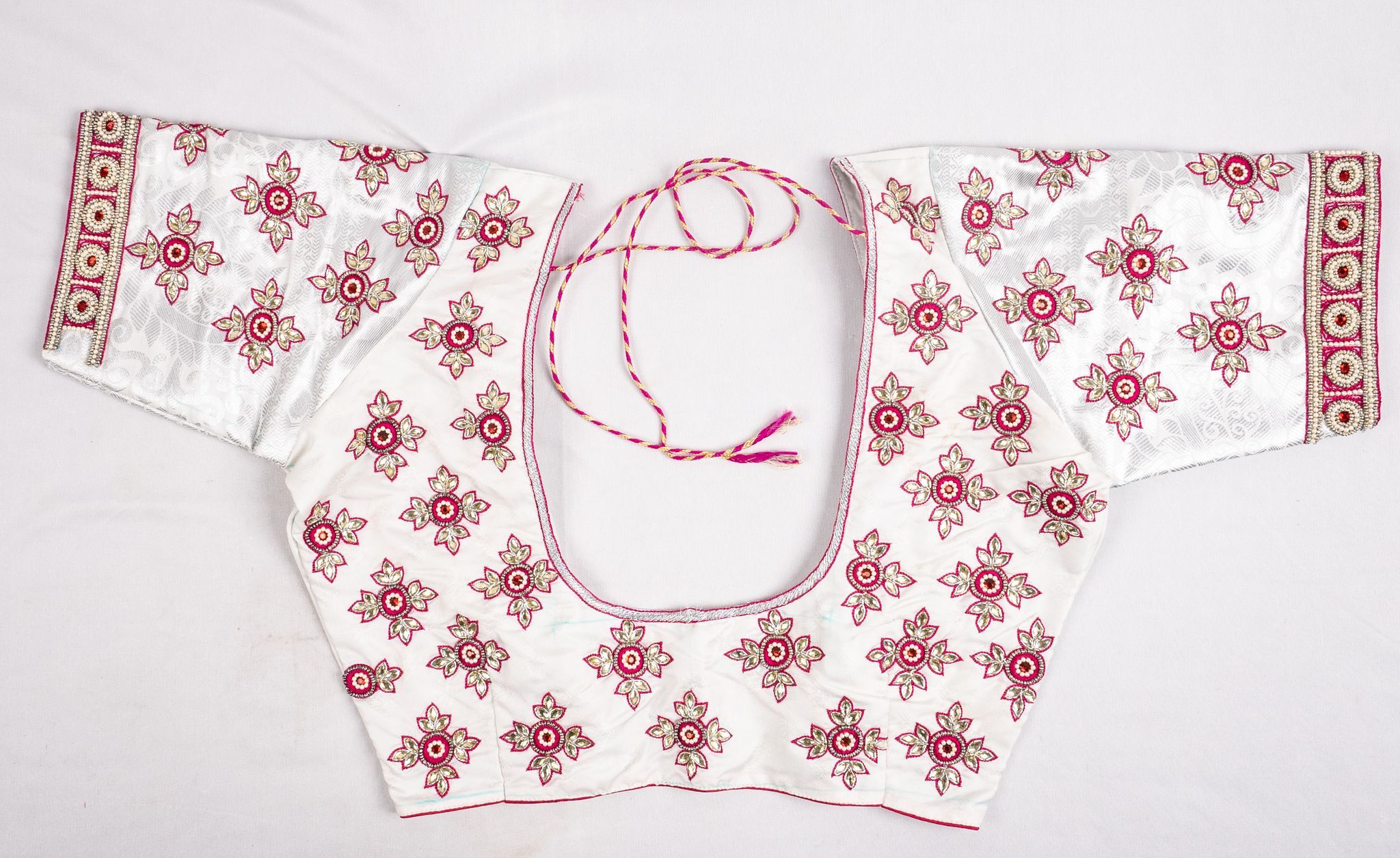 White cotton blouse with hand embroidered silver zari and pink thread work