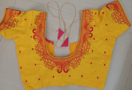 Yellow blouse with intricate zari and peacock embroidery Yellow blouse with intricate zari and peacock embroidery