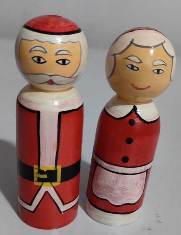 Hand-painted wooden Santa and Mrs. Claus figurines