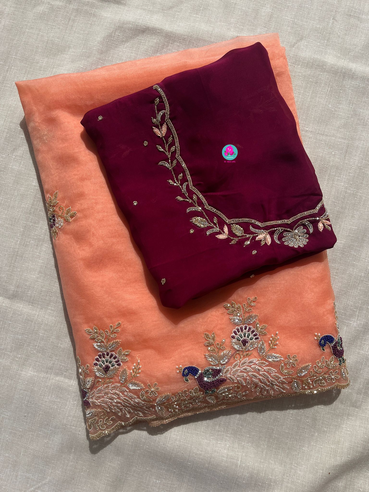 Peach Organza saree with maroon blouse