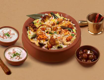1 KG Veg & Paneer Overload Matka Biryani + FREE Dessert