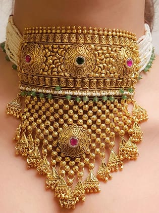 Ruby and green stones studded self flower design rajputi choker with jade bead hangings(with maangtika)