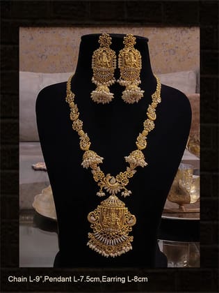 Polki,ruby,green and white stones studded ganpatiji pendant set with flowers and peacocks design