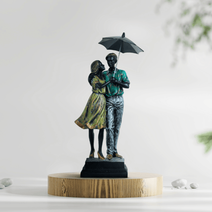 Romantic Couple Under Umbrella Statue