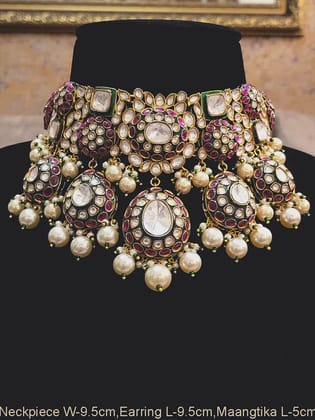 Royal uncut polki broad choker set with pearl drops and green meenakari work