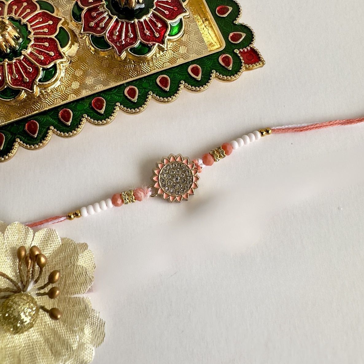 Floral Charm Rakhi – Soft, Stylish & Sweet