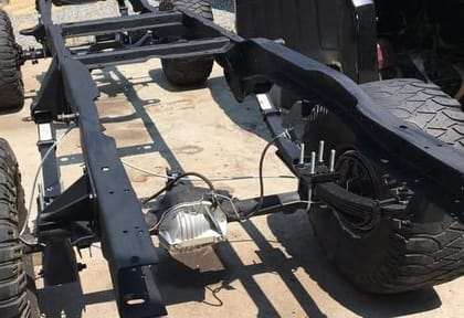 1001 Chassis Black Paint ST | Durable Black Protective Coating | Automotive & Industrial Use | Creates a tough barrier that slows down oxidation and rust on metal parts exposed to moisture and road elements. 1L