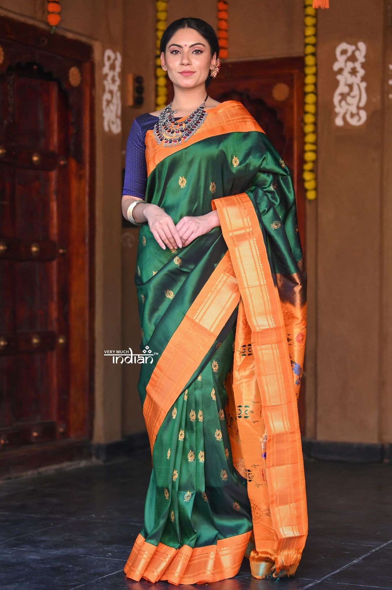Raaga~ Traditional Handloom Pure Silk Royal Green Paithani with Orange Border and Unique Pallu.
