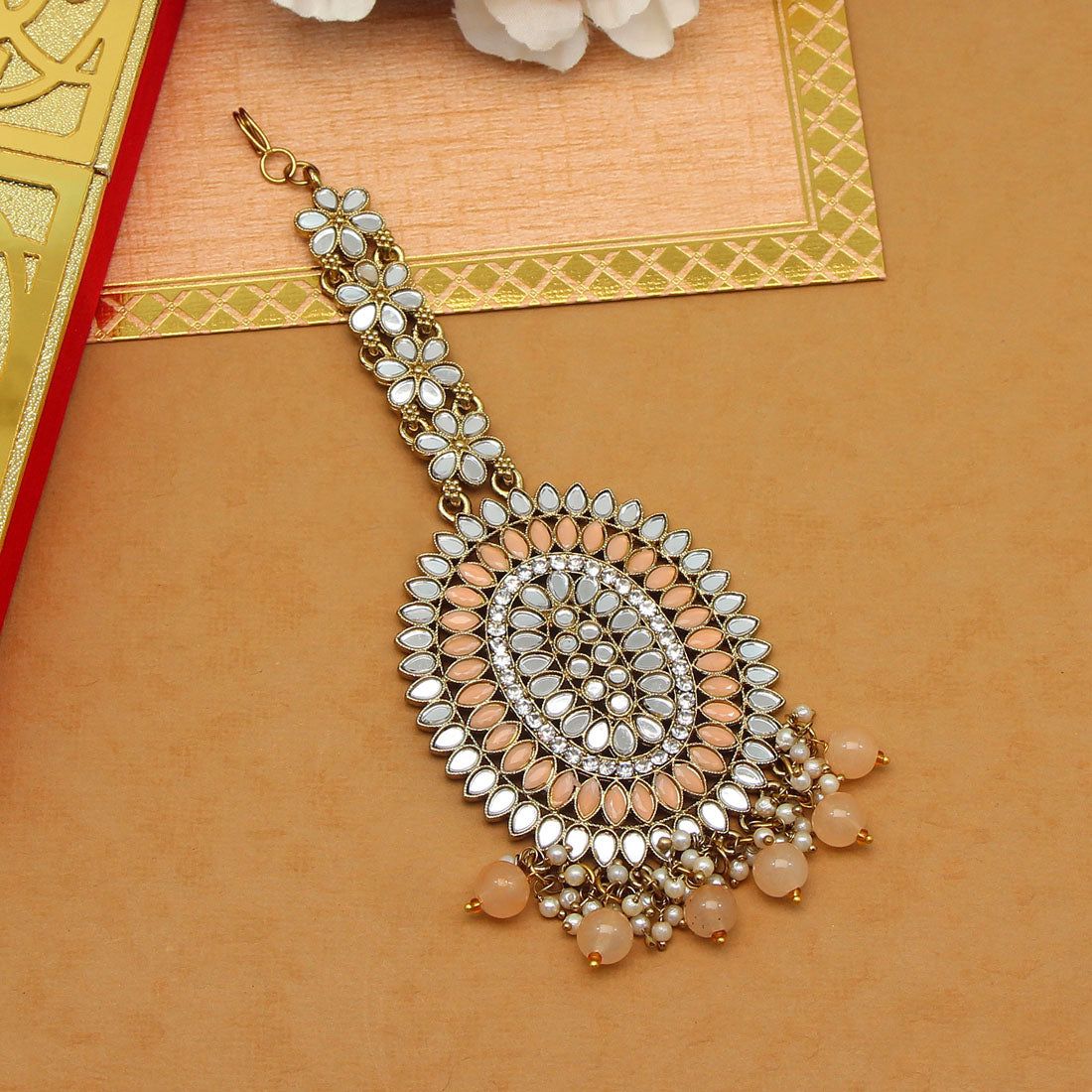Peach Color Mirror Work Maang Tikka (MTK539PCH)-Length: 12.00 CM x Width: 5.50 CM / Peach / Alloy With Good Quality Gold Plated
