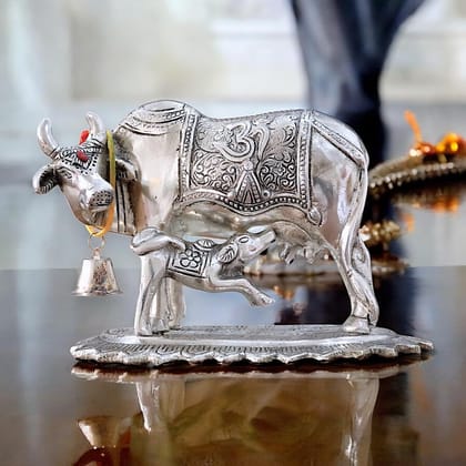 Dreamkraft Metal Om Kamdhenu Cow and Calf Statue Idol for Home, Office & Table Decoration| Silver Finish (12.5 cm) Dreamkraft Metal Om Kamdhenu Cow and Calf Statue Idol for Home, Office & Table Decoration| Silver Finish (12.5 cm)