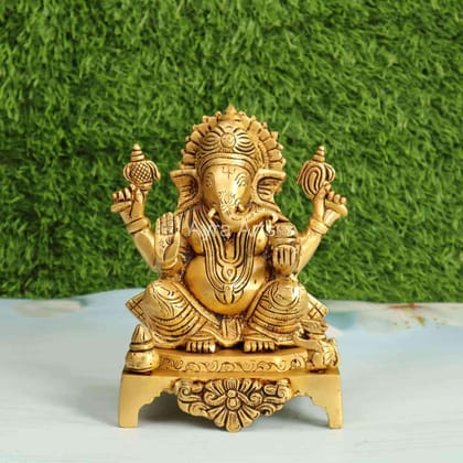 Brass Ganesh Sitting on Chowki - 7.5 Inch Height Brass Ganesh Sitting on Chowki - 7.5 Inch Height