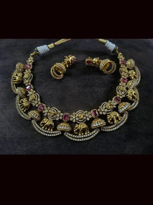 Zircons studded in half jhoomki and elephant design set with rectangular stones-Ruby