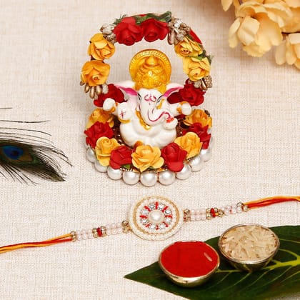 Desginer Stone and Pearl Rakhi with Lord Ganesha Idol on Decorative Plate for Car & Home and Roli Chawal Pack