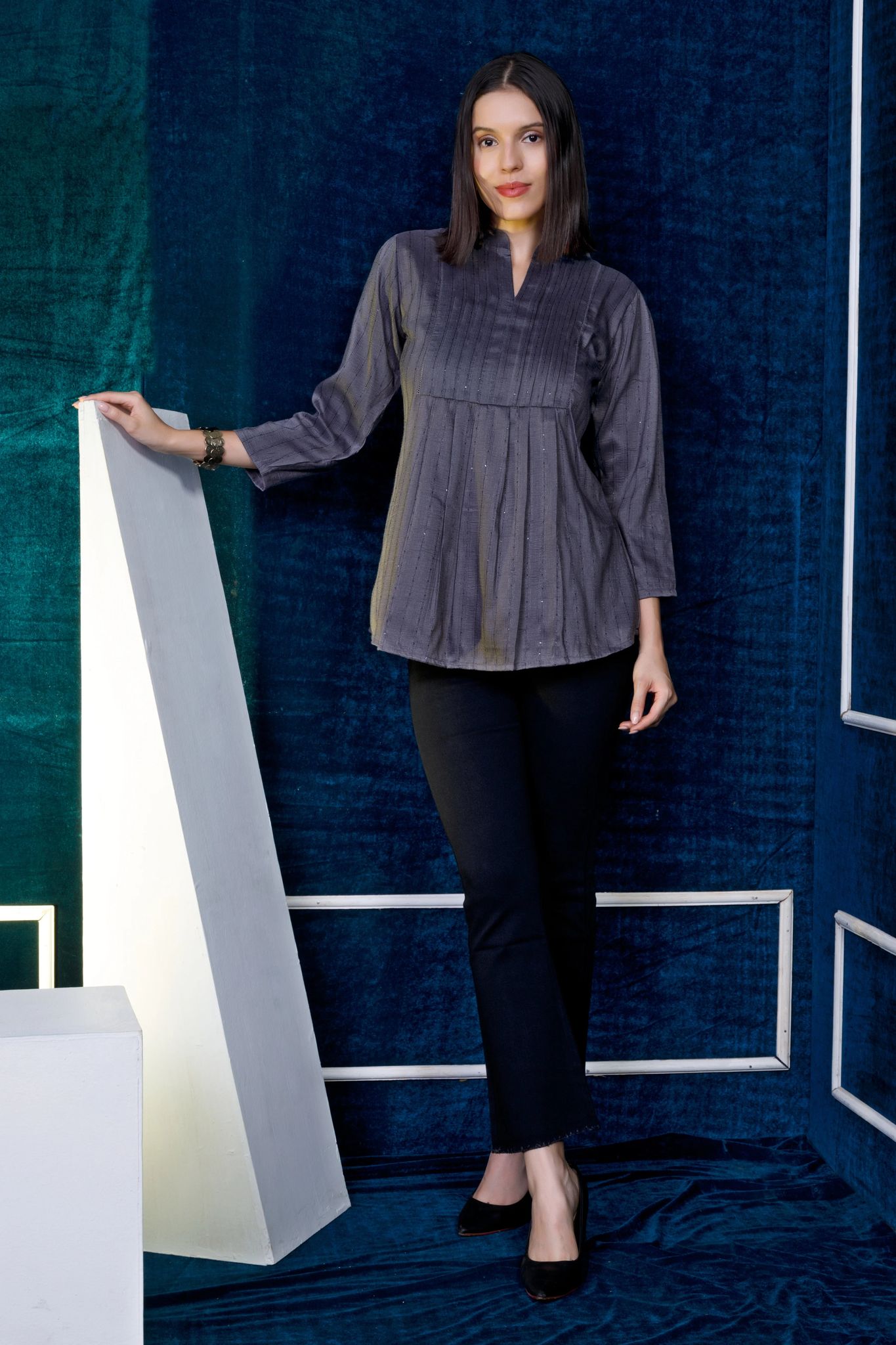 Grey top with pleating on yoke. Best teamed with Jeggings or denims.-M