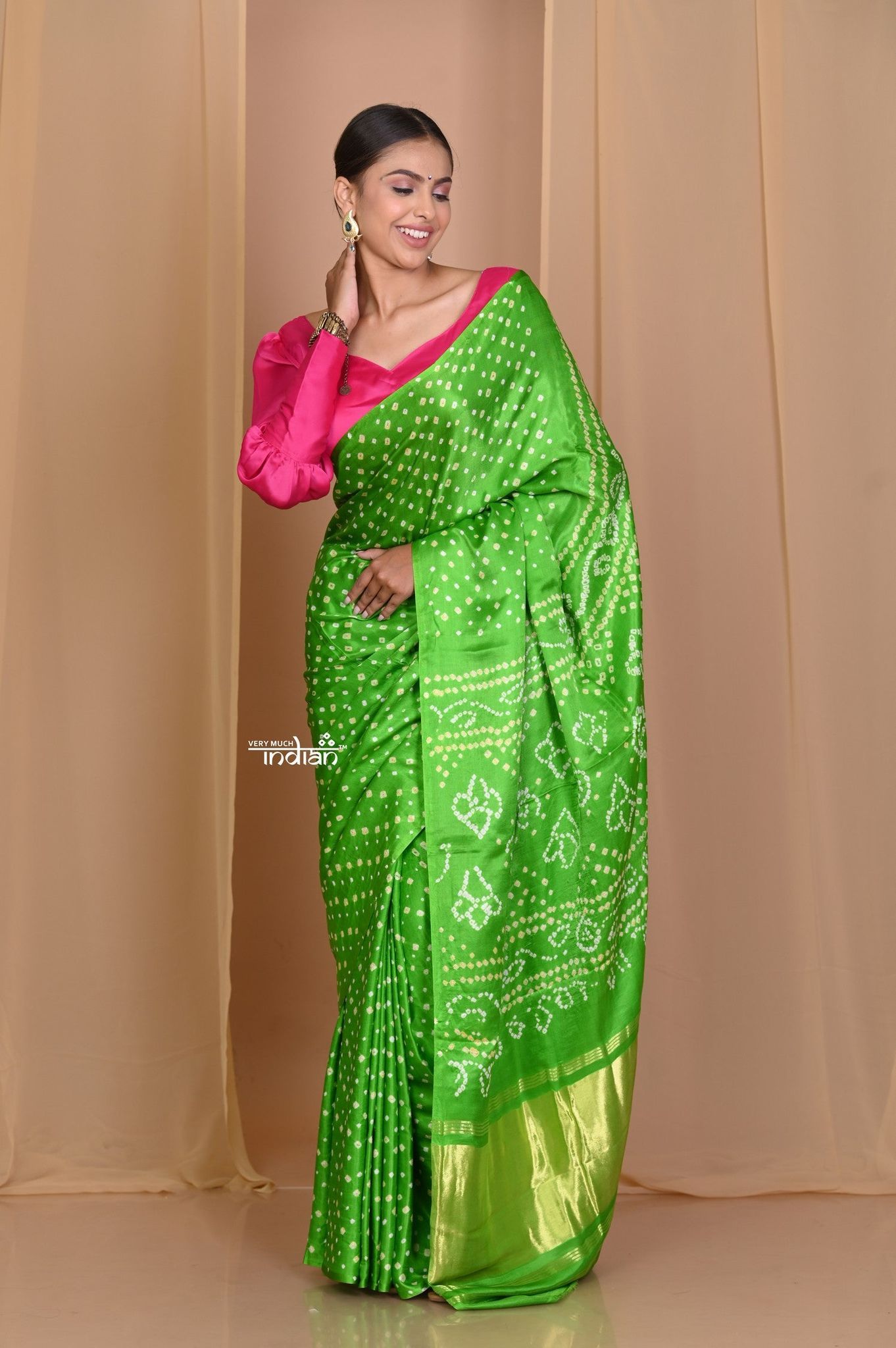 Pehal~ Traditional Blade Green Gajji silk Saree with Golden Bandhani Weave.