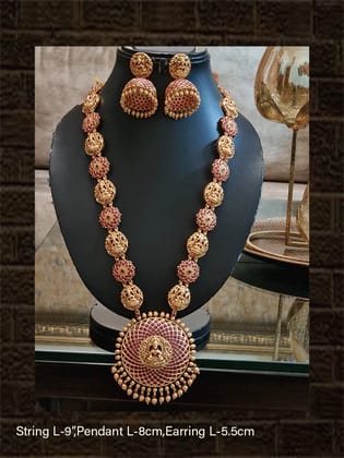 Round ruby stone studded laxmiji motif pendant long set with flower and laxmiji design side chain