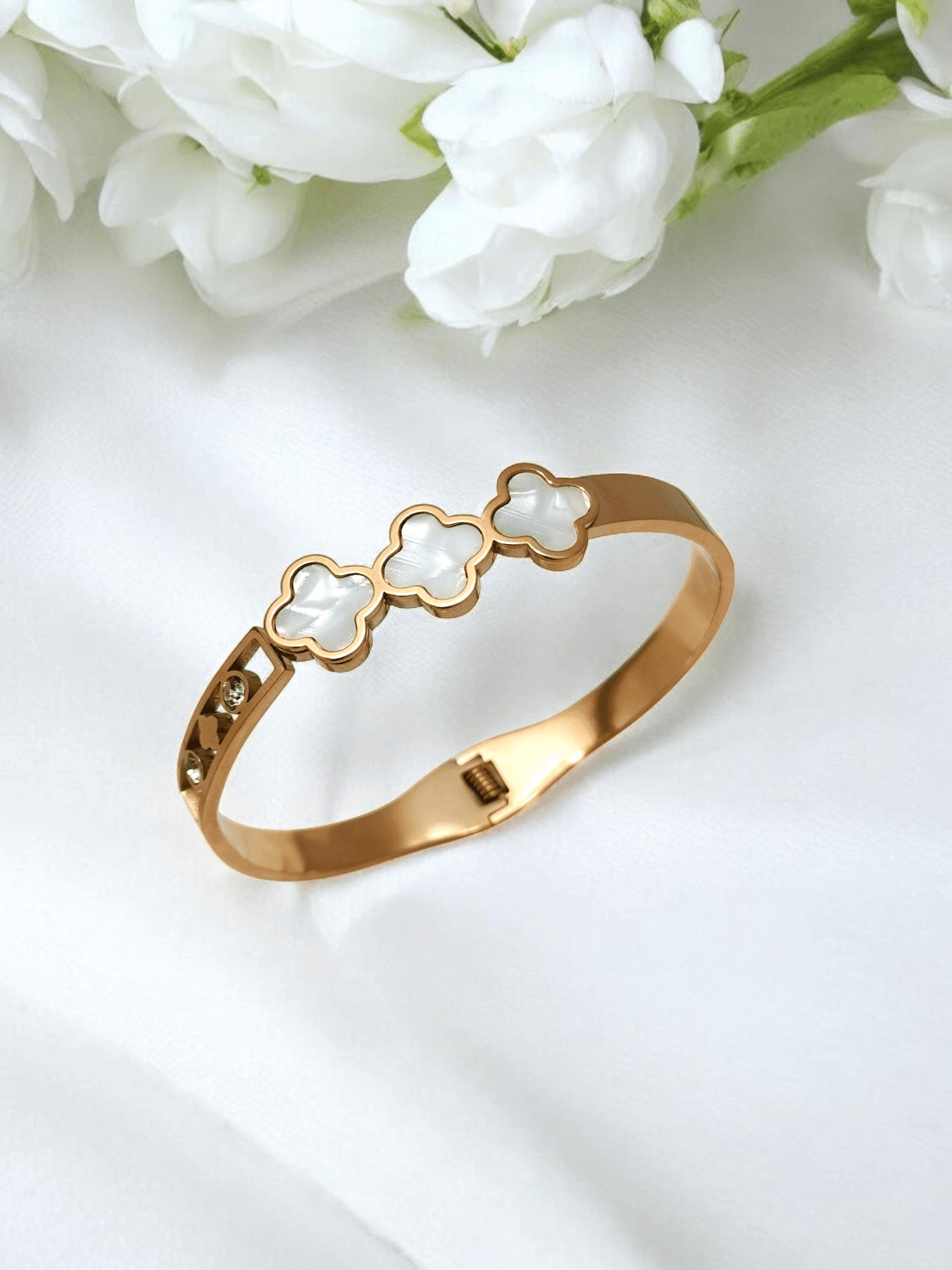 Gold Bracelet with White Flowers.