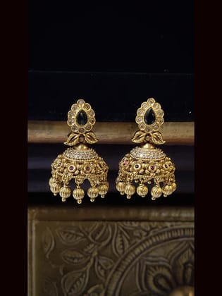 Polki studded intricate design tear drop stone center set with half jhoomki hanging in center