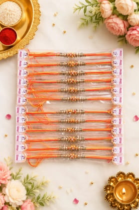Celebrate Raksha Bandhan with this elegant set of 12 lotus design rakhis. Featuring pearl-like beads, yellow accents, and red-yellow
