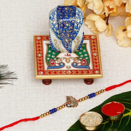 Designer Peacock Rakhi with Lord Ganesha on Marble Chowki and Roli Chawal Pack