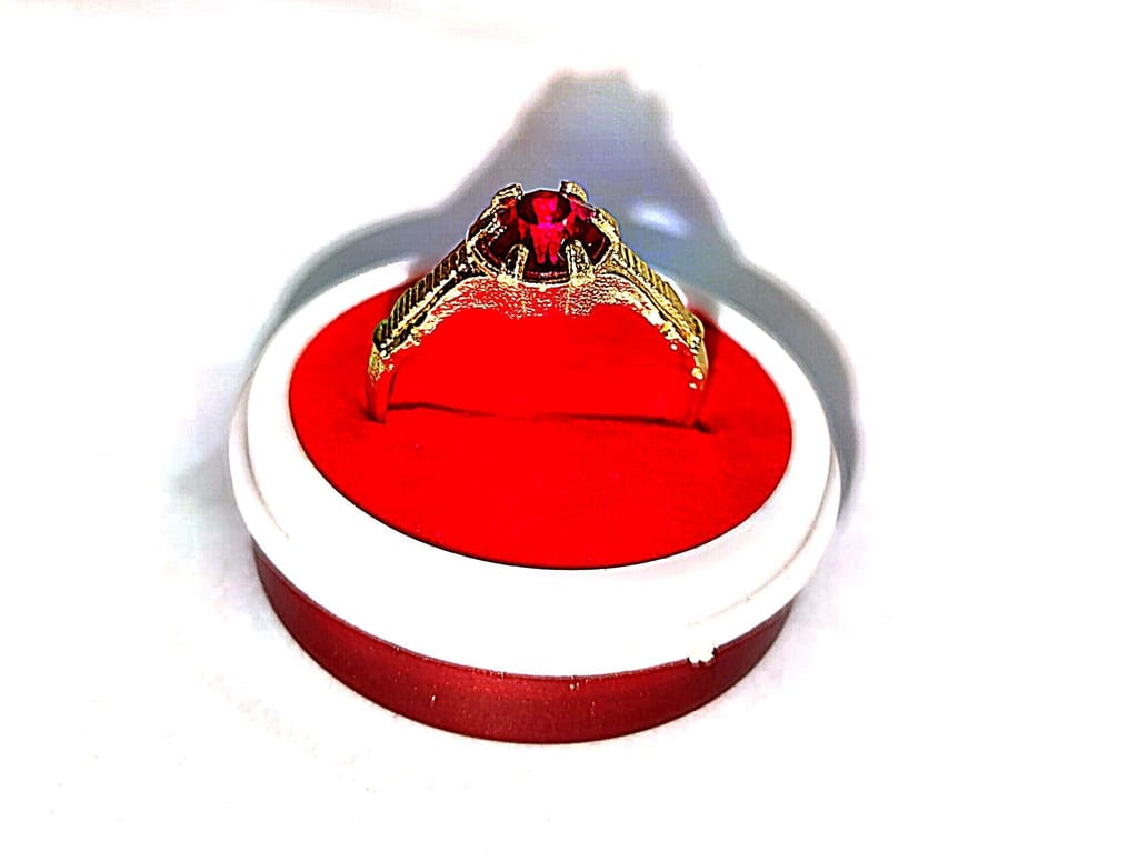 "Stunning Gold Ring with Red Gemstone"