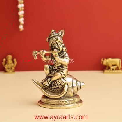 Shankh Krishna Brass Statue Bal Krishna Sitting on Shankh - 4.8 Inch Height Shankh Krishna Brass Statue Bal Krishna Sitting on Shankh - 4.8 Inch Height
