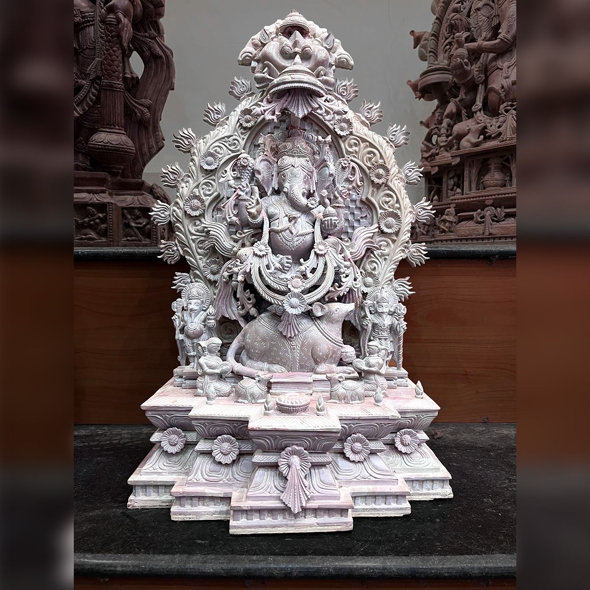 Lord Ganesha sitting on a mouse Pink Stone Statue