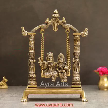 Divine Brass Radhakrishna Sitting on Swing Jhula for Devotion - 12 inch Height Divine Brass Radhakrishna Sitting on Swing Jhula for Devotion - 12 inch Height