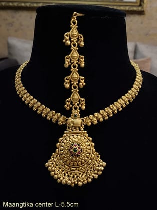 Circular with elephant top ruby and green stone flower center mathapatti