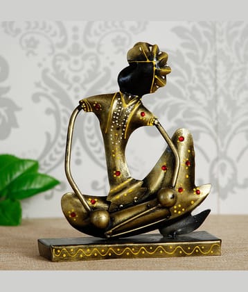 eCraftIndia Gold-Toned & Black Tribal Man with Pagdhi Playing Musical Instrument Dholak Decorative Showpiece