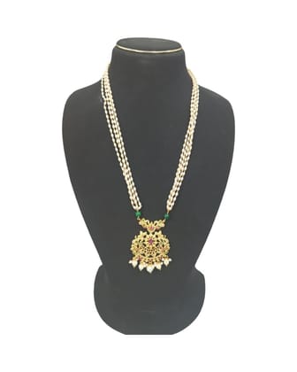 Pearl and gold necklace with intricate detailing and a floral pendant.