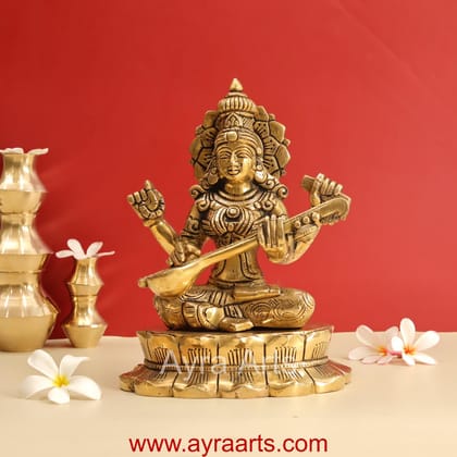 Buy Brass Superfine Goddess Saraswati Sitting on Lotus - 11 Inch Height Buy Brass Superfine Goddess Saraswati Sitting on Lotus - 11 Inch Height